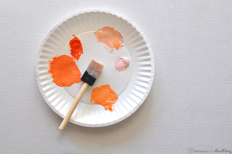 Paper plate with orange paints