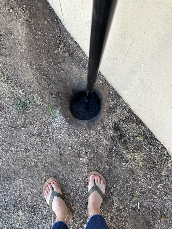 Filling hole in ground with concrete