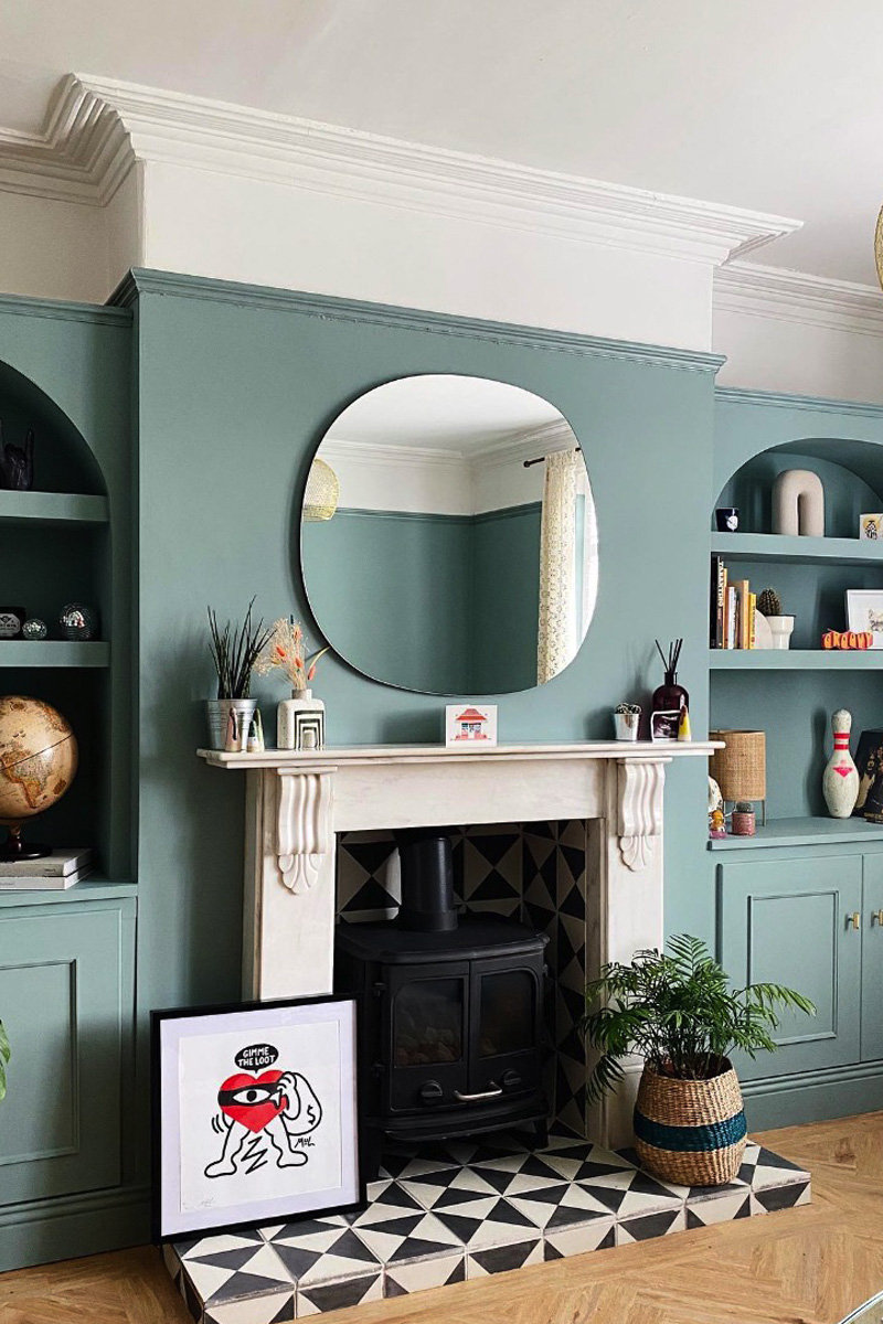 Teal living room with graphic fireplace tile