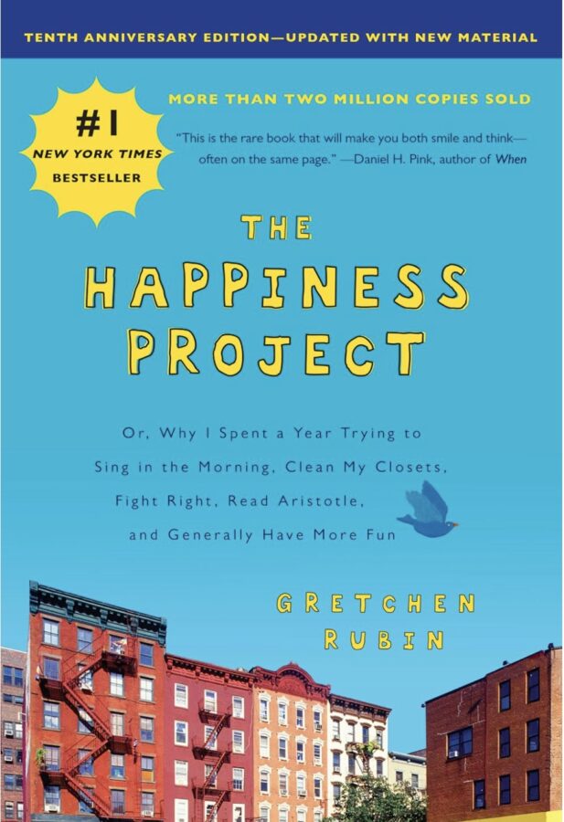 The Happiness Project, blue cover with the tops of city buildings - Self Help book