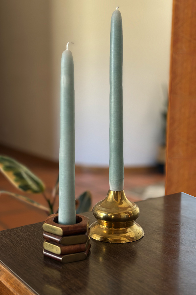Two blue taper candles in Thrifted Napkin Ring Candle Holders