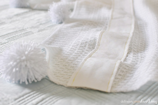 White pom pom blanket