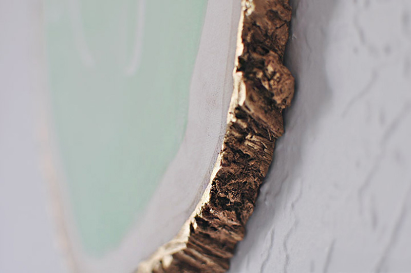 Gold painted edge of a tree slice project