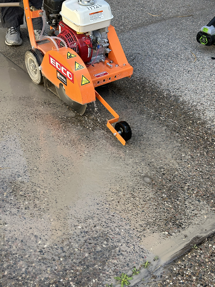 Wet Concrete Saw cutting patio