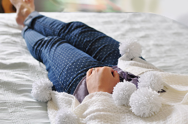 White blanket on bed